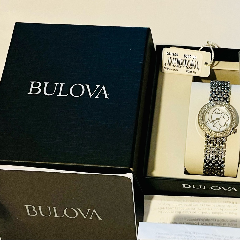 Like new Bulova watch with 58 diamonds and mother of pearl face. 96R209